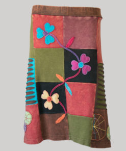 Gypsy rib skirt with asymmetrical razor cut patches and hand work front