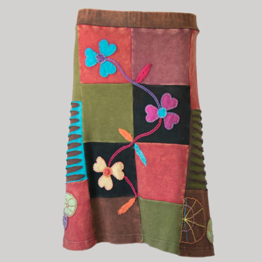 Gypsy rib skirt with asymmetrical razor cut patches and hand work front