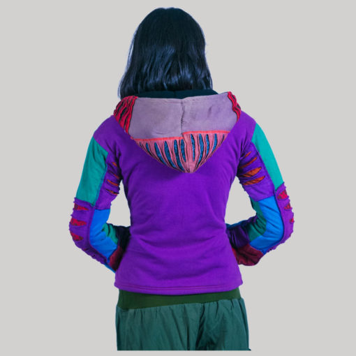 Women's jacket with asymmetrical razor cut patches