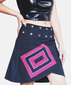 Black cotton wrap skirt with pink and purple geometric patchwork and metal stud detailing on the waistband.